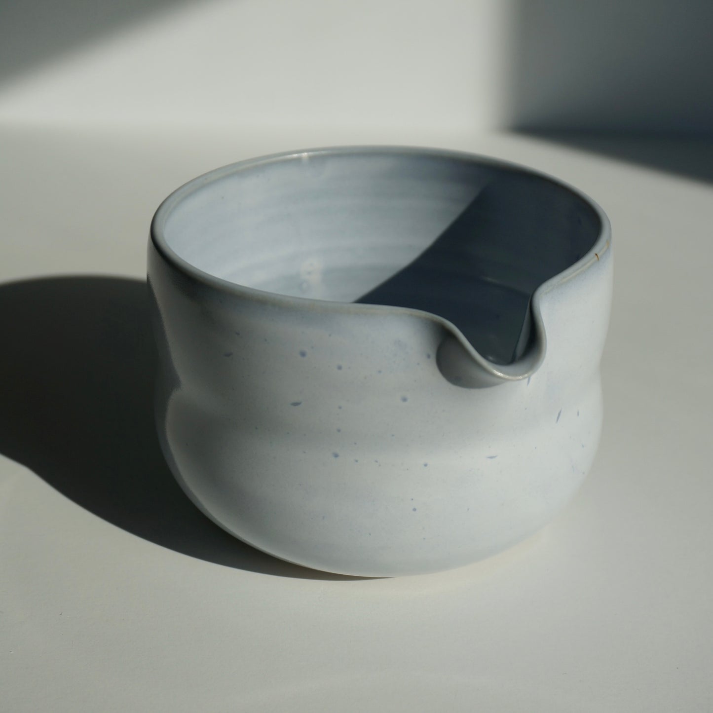 handmade ceramic spouted matcha bowl in light blue glaze by Kongji Pottery