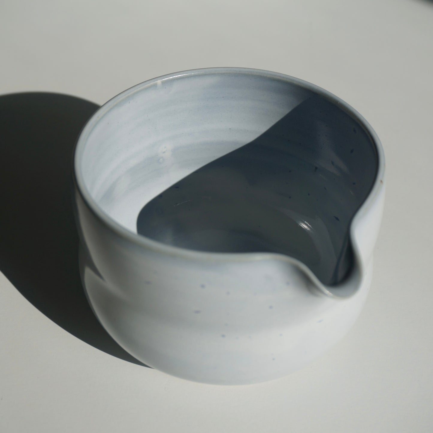 handmade ceramic spouted matcha bowl in light blue glaze by Kongji Pottery