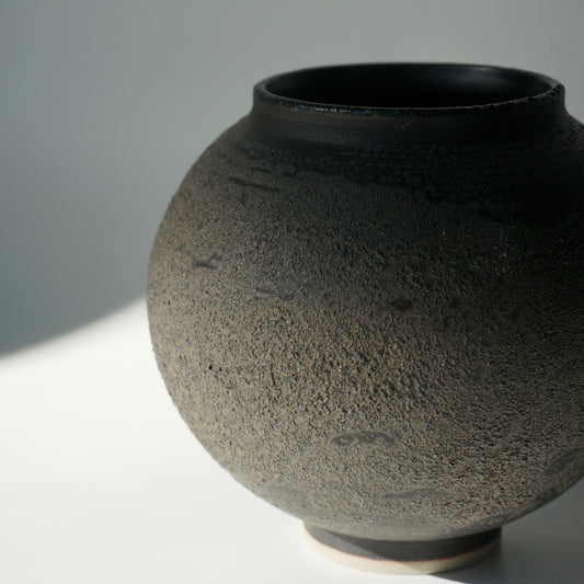 Black textured handmade ceramic moon jar by Kongji Pottery