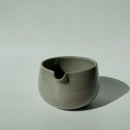 handmade ceramic spouted matcha bowl in crackled celadon green glaze by Kongji Pottery