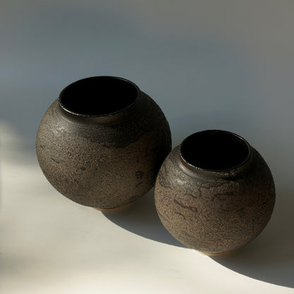 Two black textured handmade ceramic moon jars by Kongji Pottery