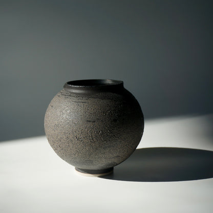 Black textured handmade ceramic moon jar by Kongji Pottery