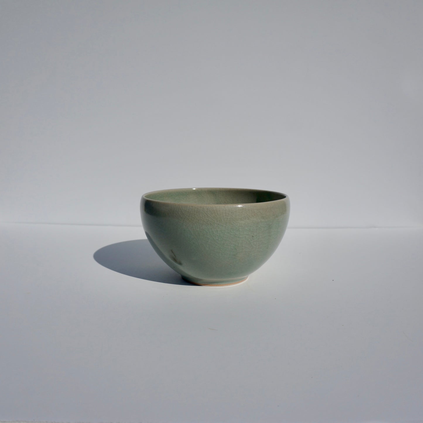 Handmade ceramic ramen bowl in crackled celadon glaze by Kongji Pottery