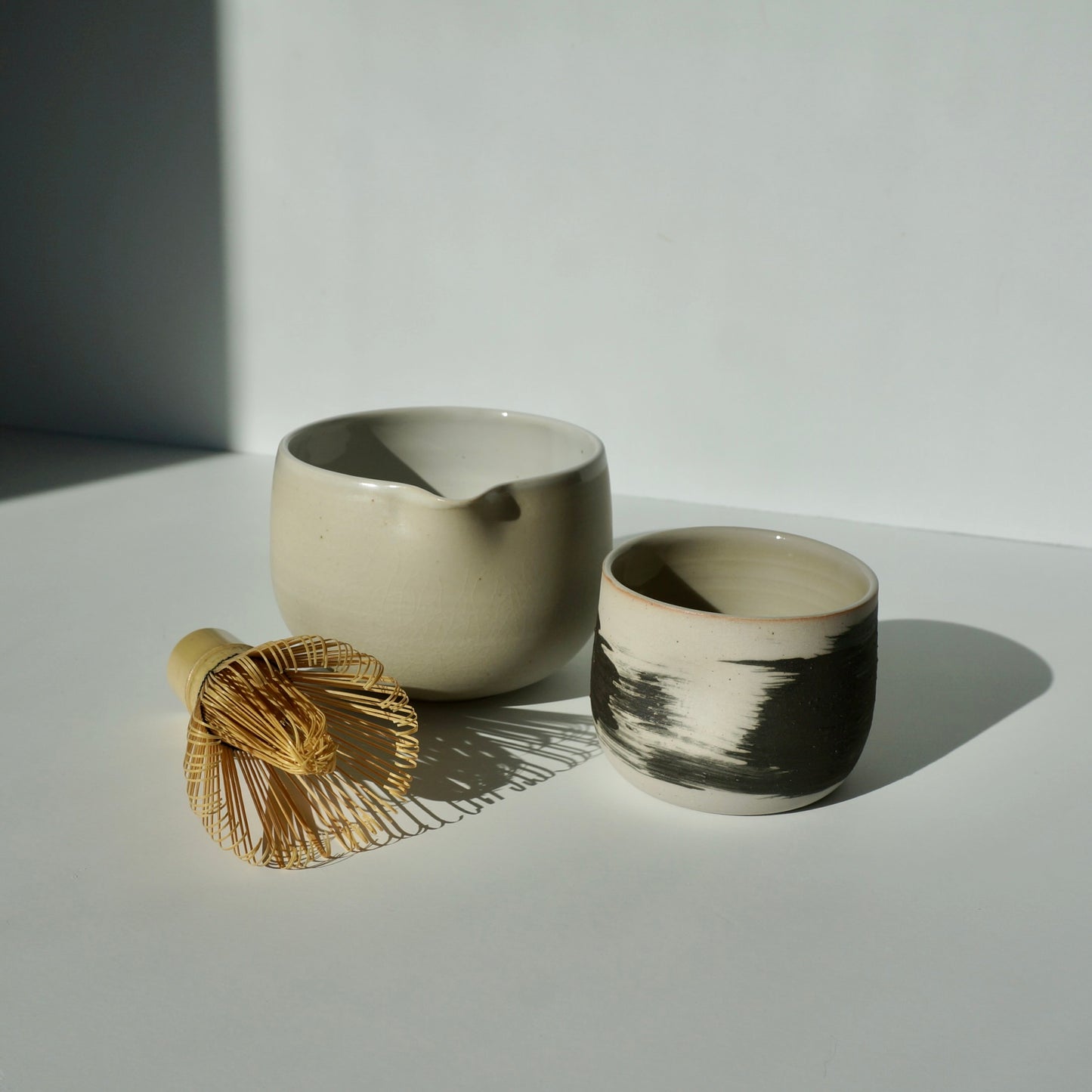 handmade ceramic dimple pinch cup and spouted matcha bowl set by Kongji Pottery