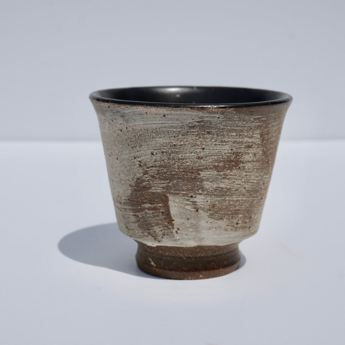 Handmade ceramic teacup by Kongji Pottery