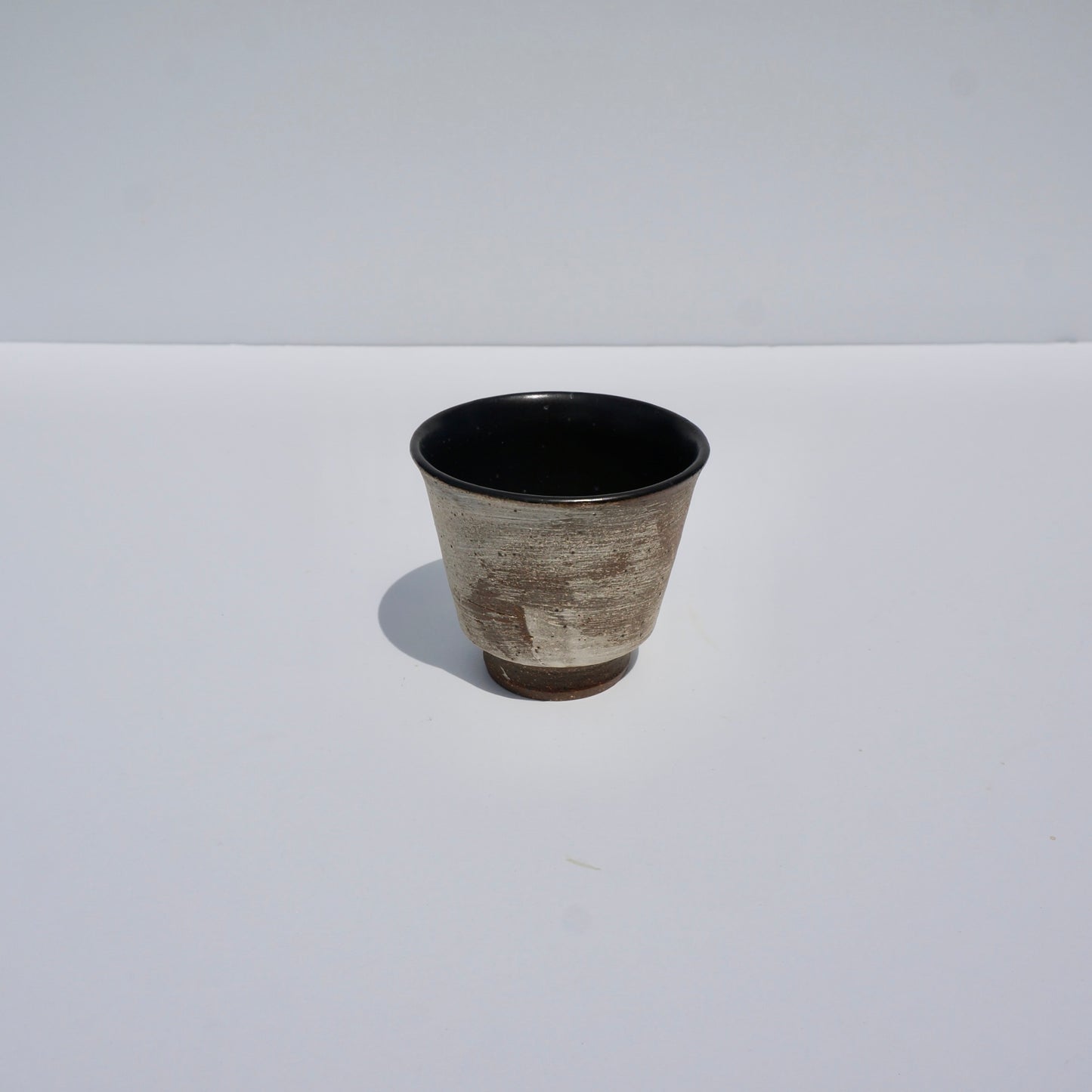 Handmade ceramic teacup by Kongji Pottery