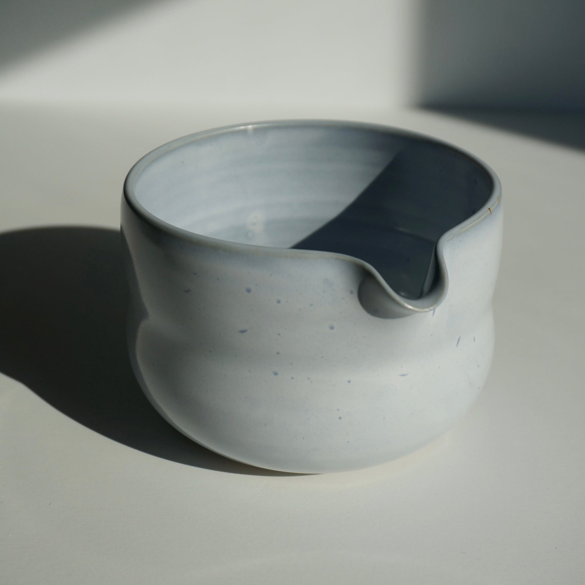 handmade ceramic spouted matcha bowl in light blue glaze by Kongji Pottery