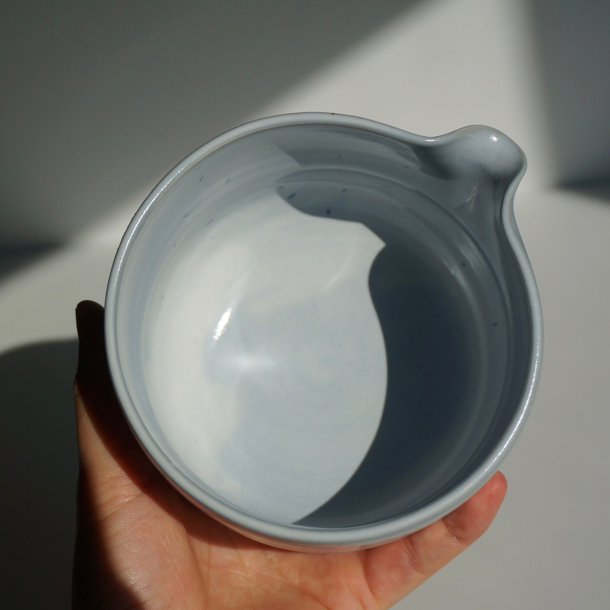handmade ceramic spouted matcha bowl in light blue glaze by Kongji Pottery