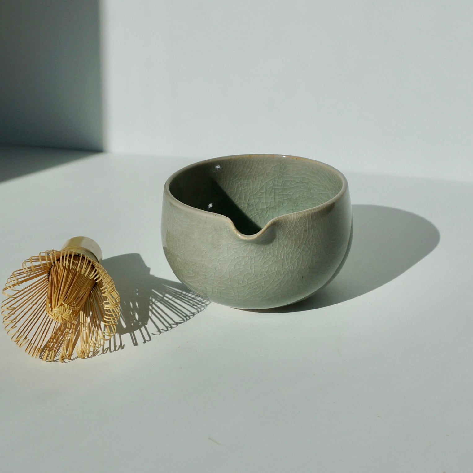 Handmade ceramic spouted matcha bowl in crackled celadon glaze by Kongji Pottery