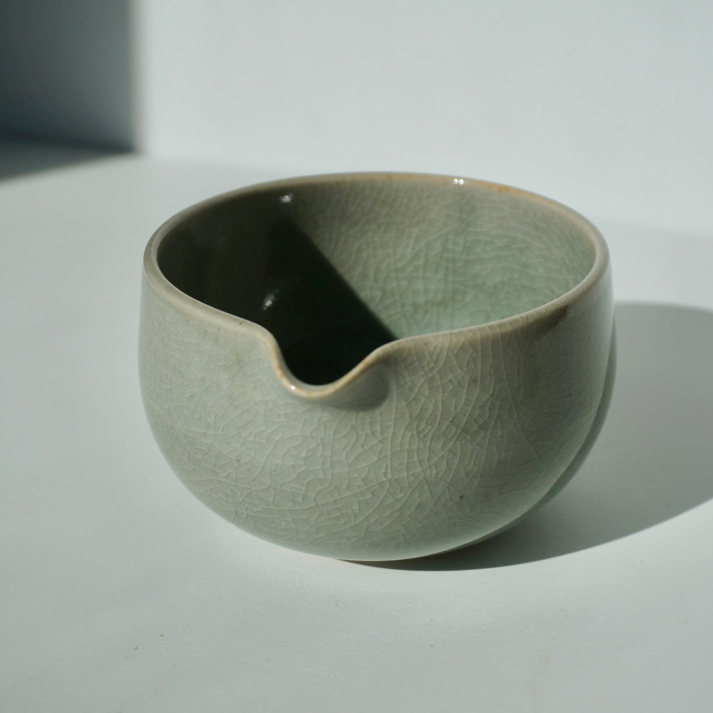 Handmade ceramic spouted matcha bowl in crackled celadon glaze by Kongji Pottery