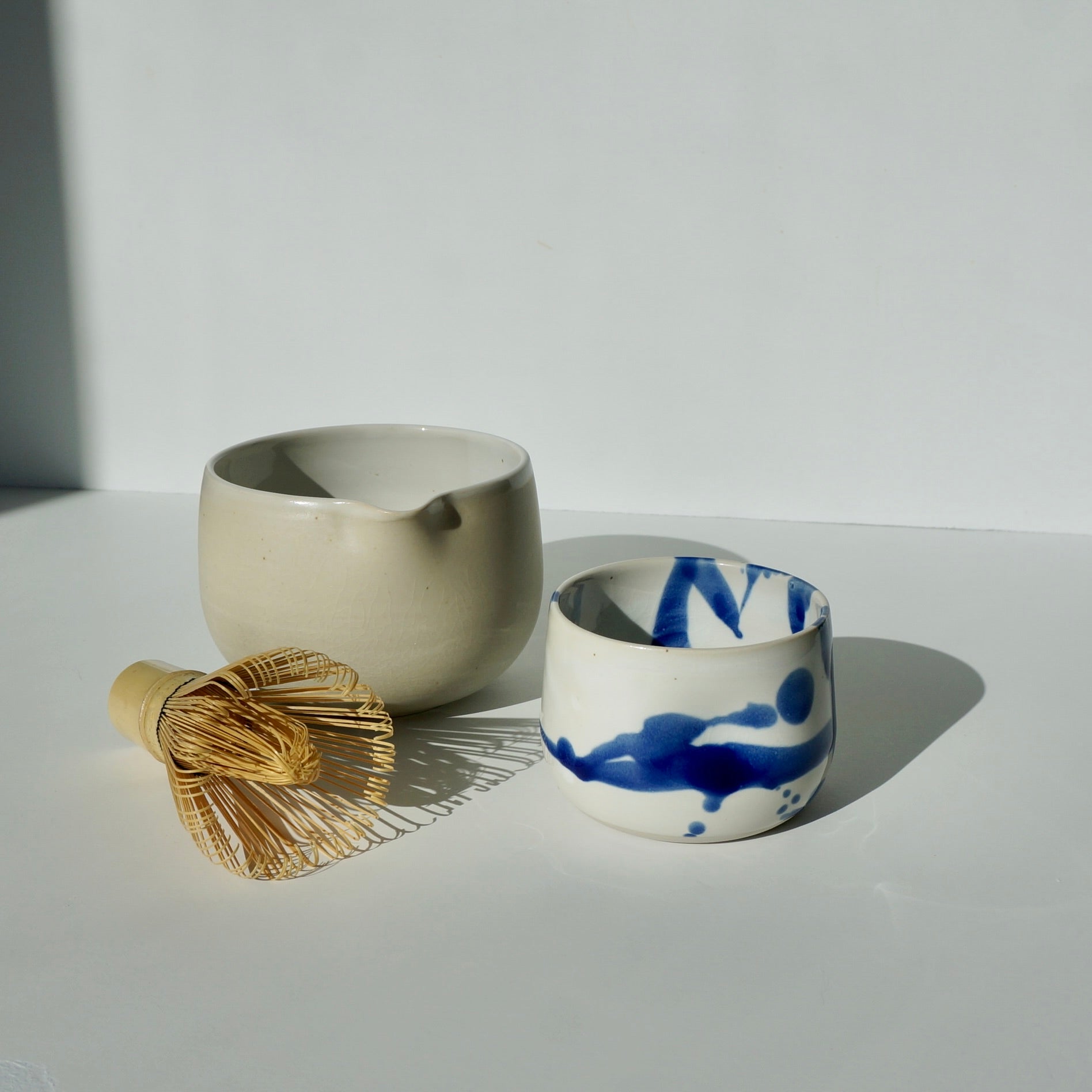 handmade ceramic pinch cup and spouted matcha bowl by Kongji Pottery