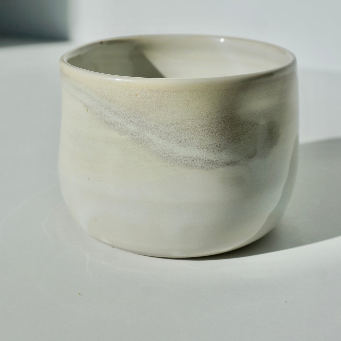 handmade ceramic dimple cup in pearlescent glaze by Kongji Pottery