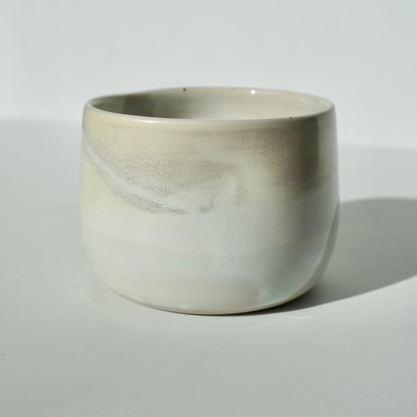 handmade ceramic dimple cup in pearlescent glaze by Kongji Pottery