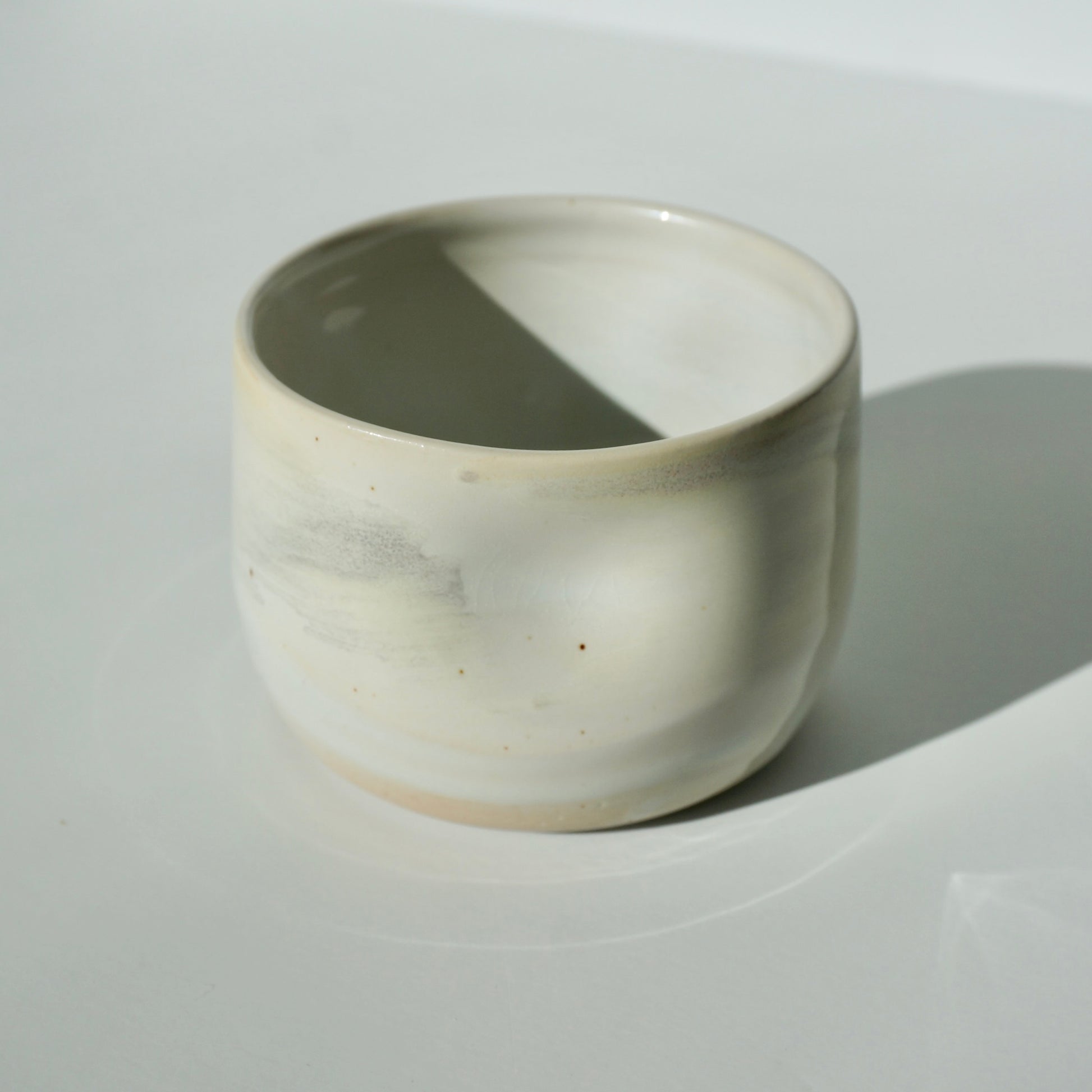 handmade ceramic dimple cup in pearlescent glaze by Kongji Pottery