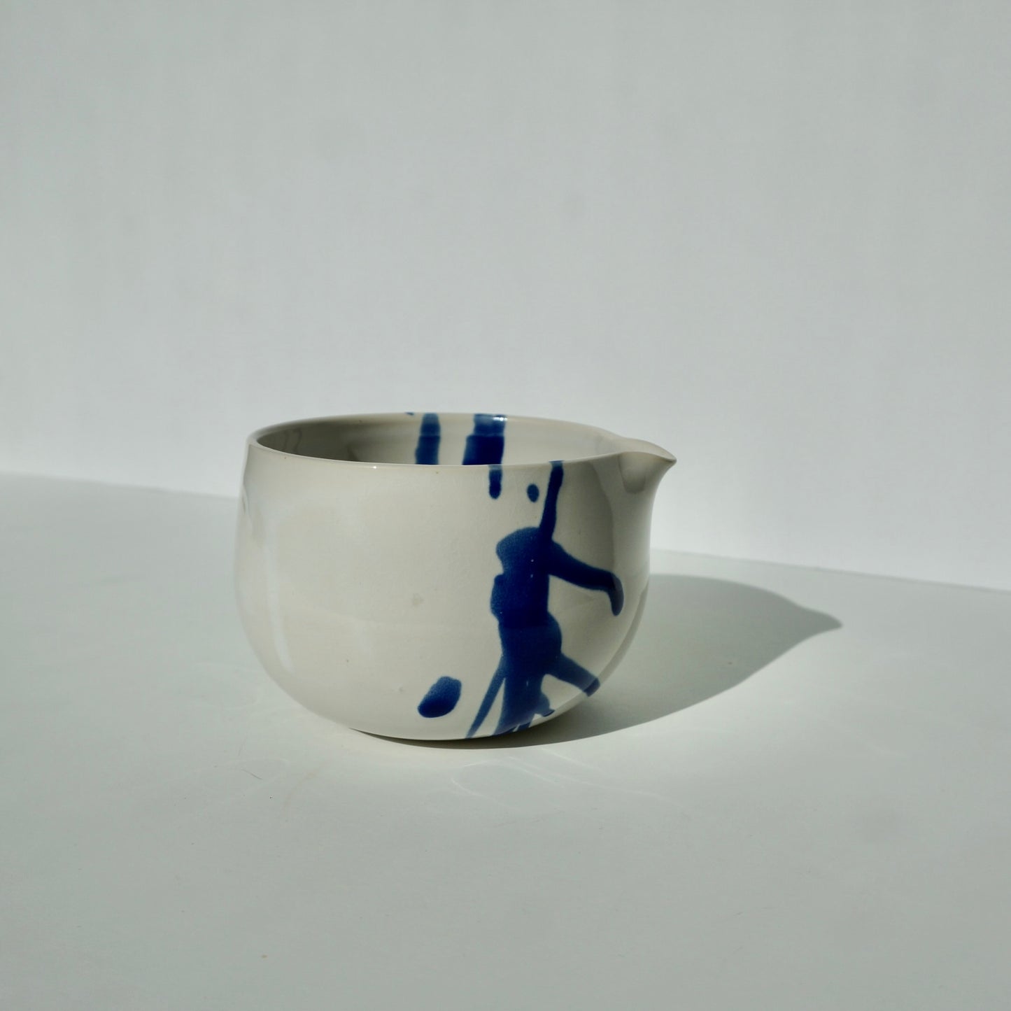 handmade ceramic spouted matcha bowl glossy white with cobalt blue by Kongji Pottery