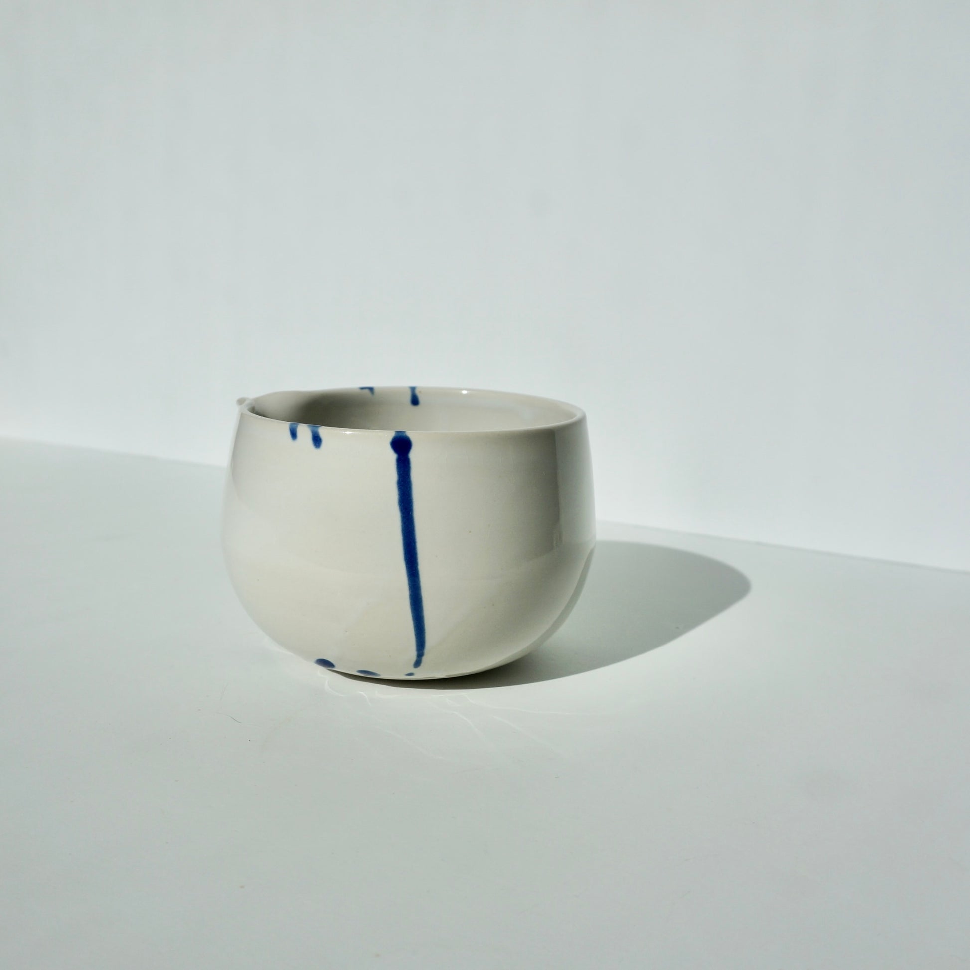 handmade ceramic spouted matcha bowl glossy white with cobalt blue by Kongji Pottery