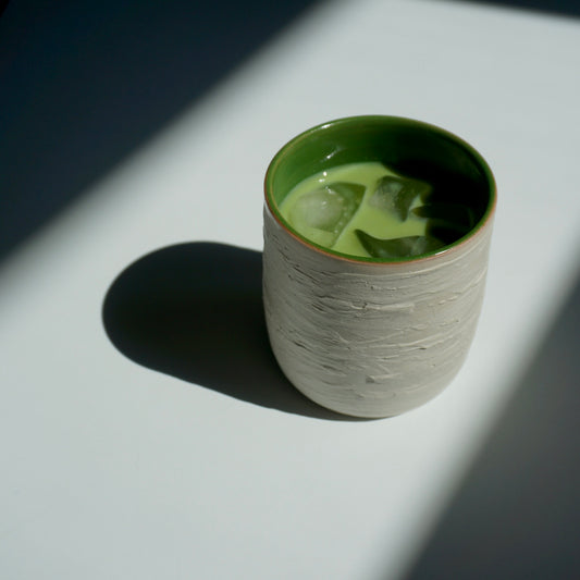 handmade ceramic cup with green interior and textured exterior by Kongji Pottery