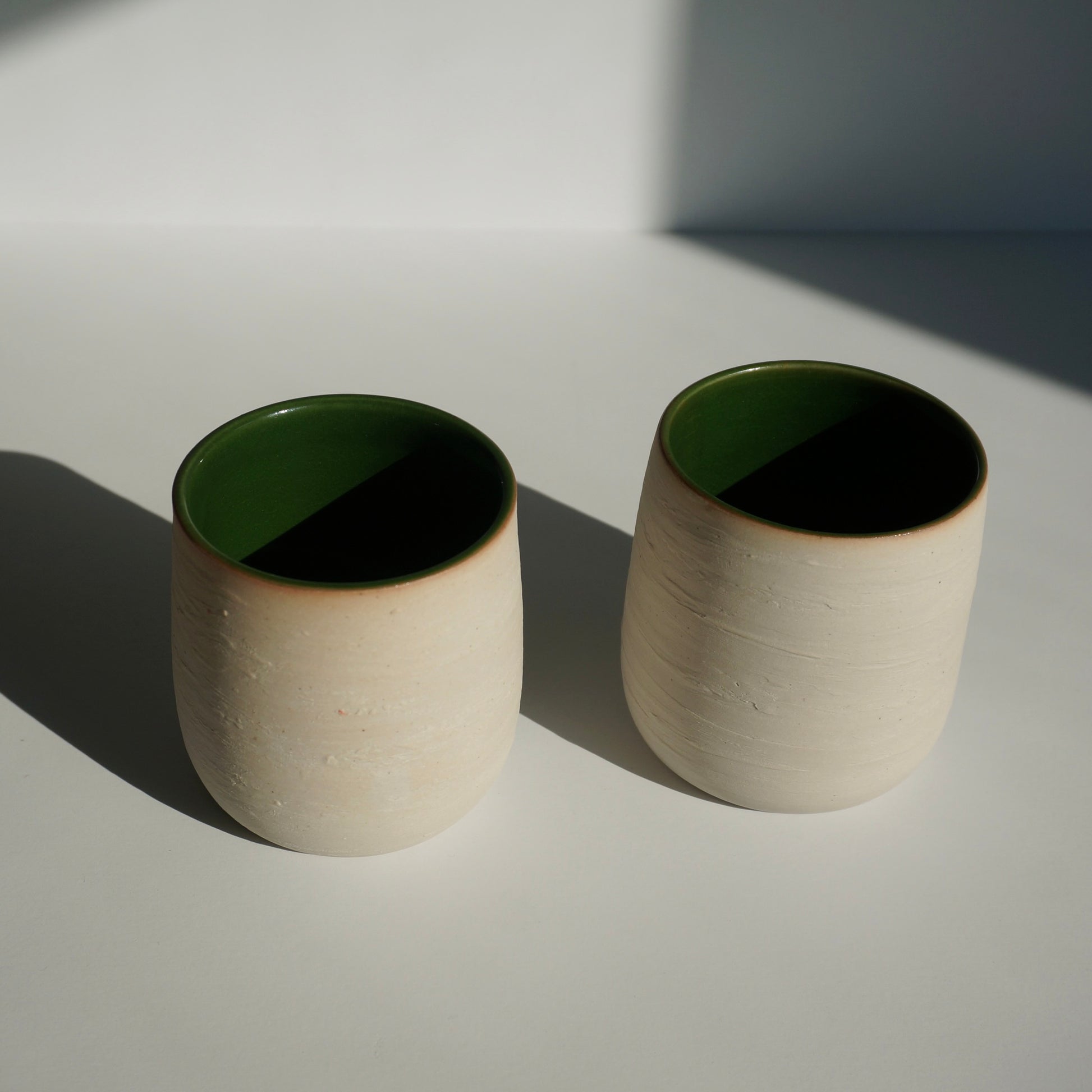 handmade ceramic cups with green interior and textured exterior by Kongji Pottery