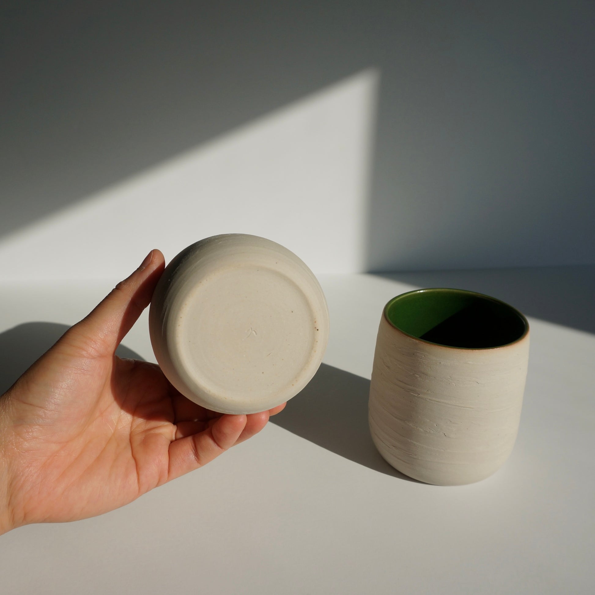 handmade ceramic cups with green interior and textured exterior by Kongji Pottery